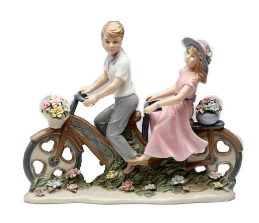 Cosmos Couple Biking Around Figurine 8 1/2"